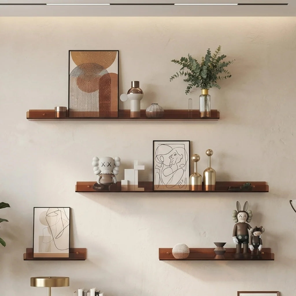 Brown acrylic floating shelf with picture frames