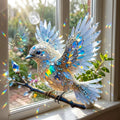 Acrylic bluebird suncatcher hanging on a branch
