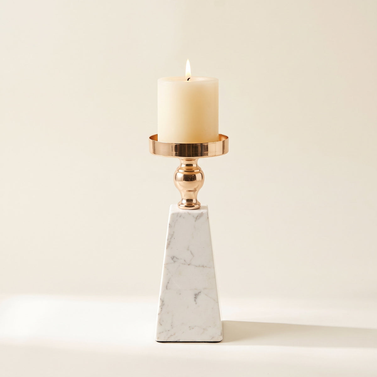 Aurum marble candle holder in the taller 22cm height with a lit pillar candle, Style Room