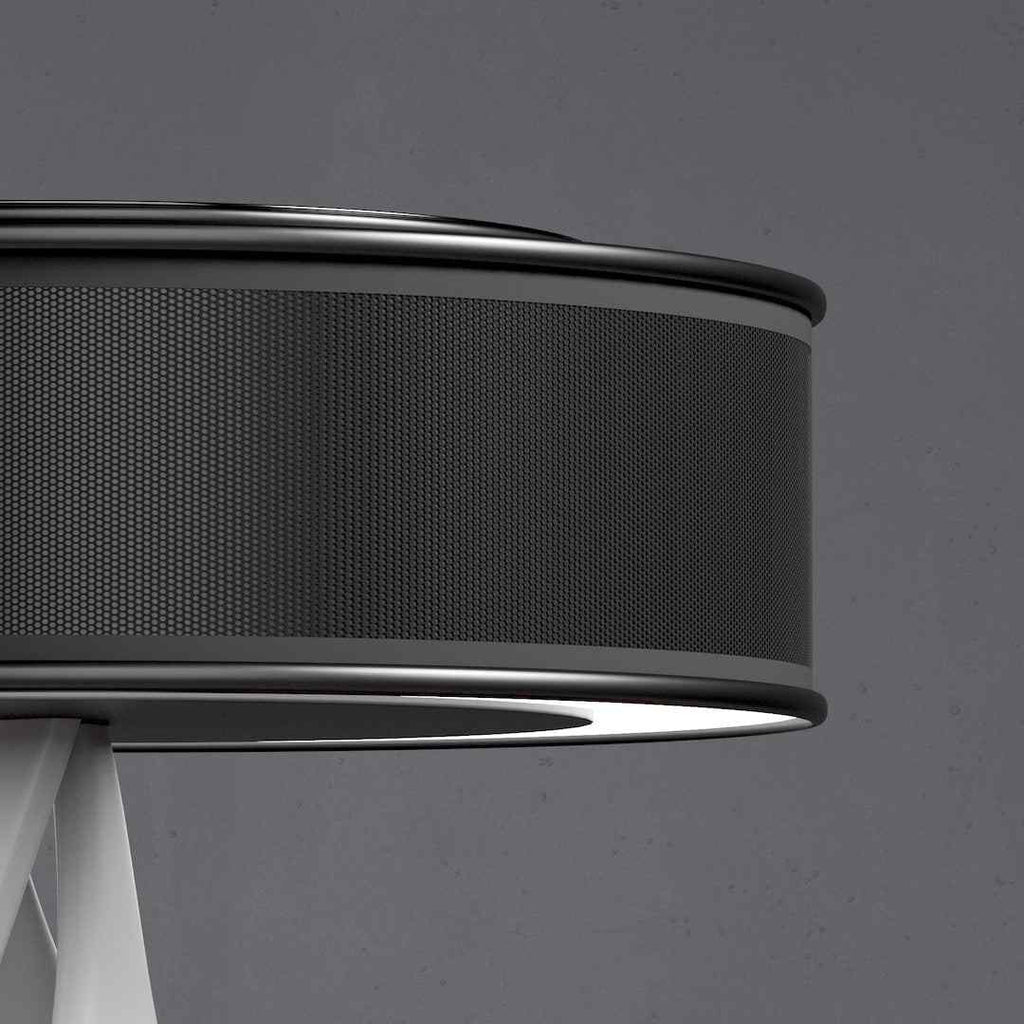 Bexon table lamp lit in a dark room, blue ring glowing around the base