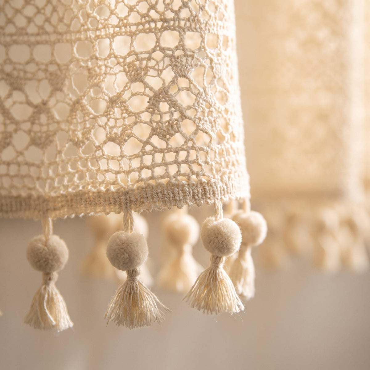 Close-up of the crochet lace and pom-pom trim of the Blythe curtain, Style Room