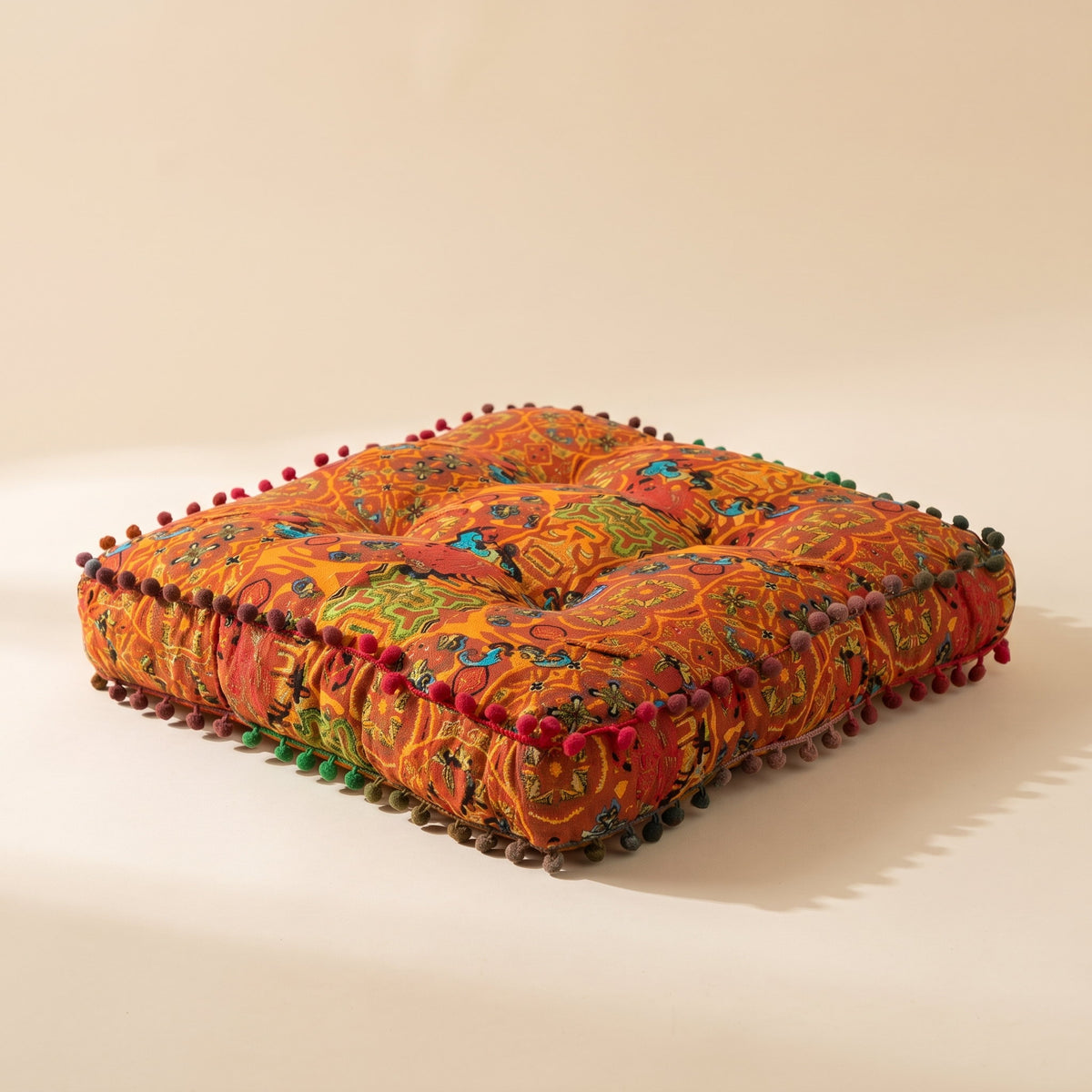 Blythe floor cushion in rust orange embroidered fabric with pom-pom trim, square, Style Room