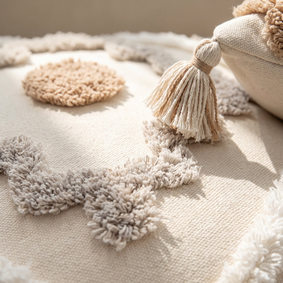 Close-up of the tufted diamond motif and tassel on the Blythe cushion cover, Style Room