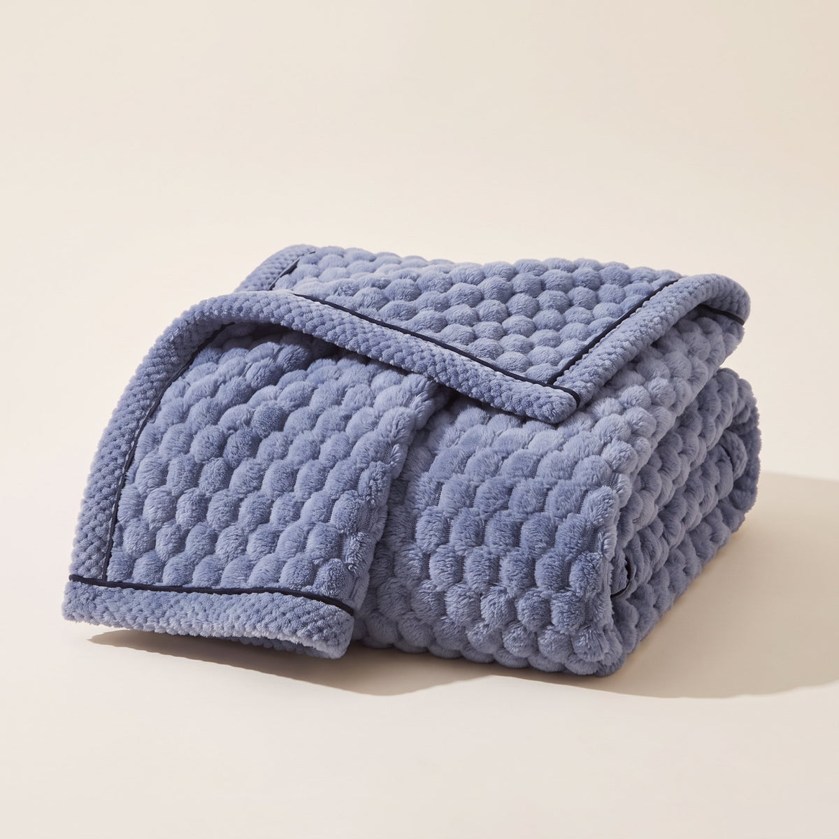 Cielo plush blanket in berry blue, bubble-textured sherpa fleece, folded, Style Room