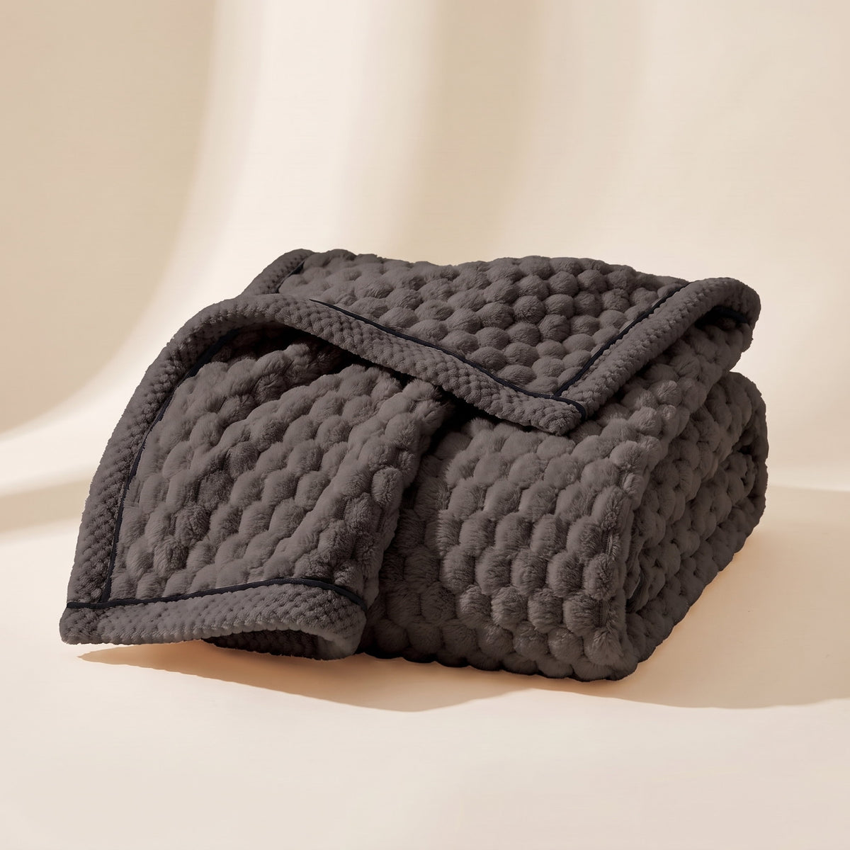 Cielo plush blanket in charcoal grey, bubble-textured sherpa fleece, folded, Style Room