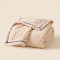 Cielo plush blanket in ivory cream, bubble-textured sherpa fleece, folded, Style Room