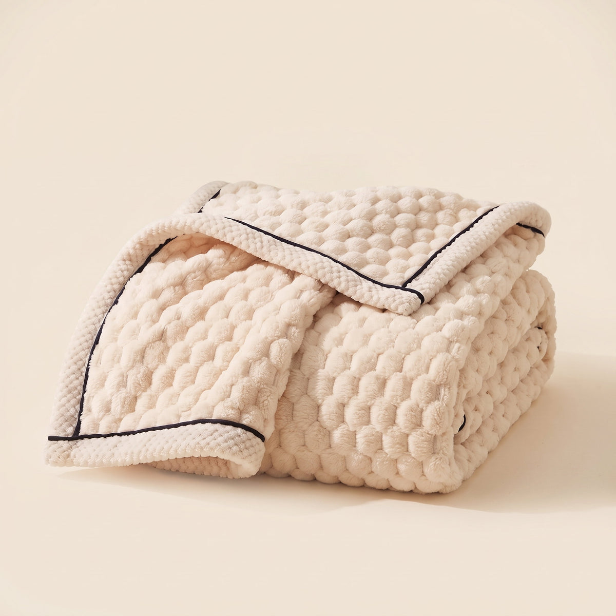 Cielo plush blanket in ivory cream, bubble-textured sherpa fleece, folded, Style Room