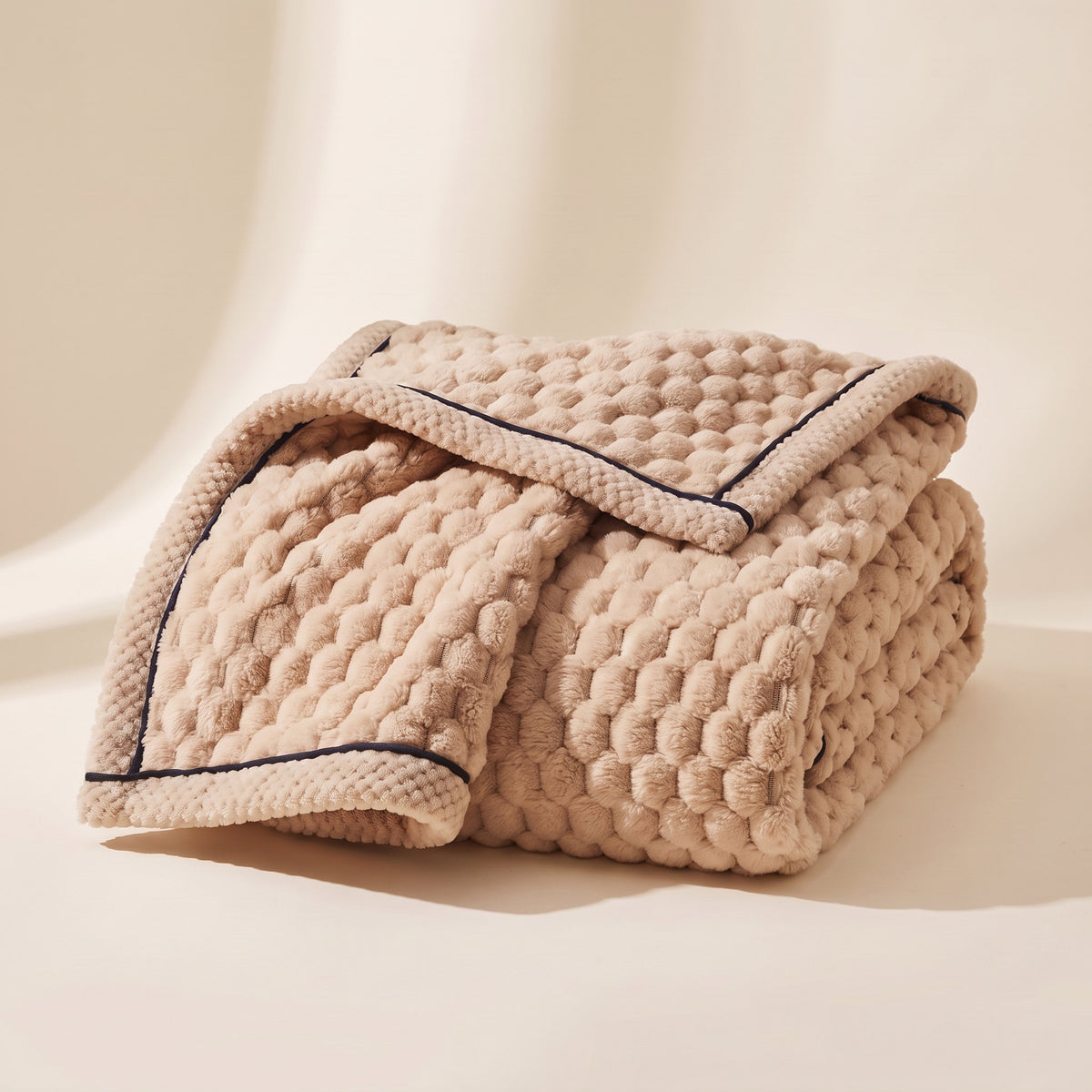 Cielo plush blanket in latte beige, bubble-textured sherpa fleece, folded, Style Room