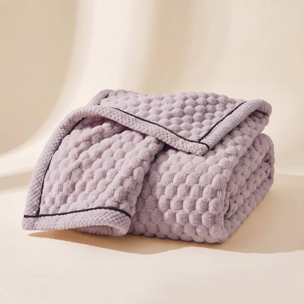 Cielo plush blanket in purple passion lilac, bubble-textured sherpa fleece, folded, Style Room