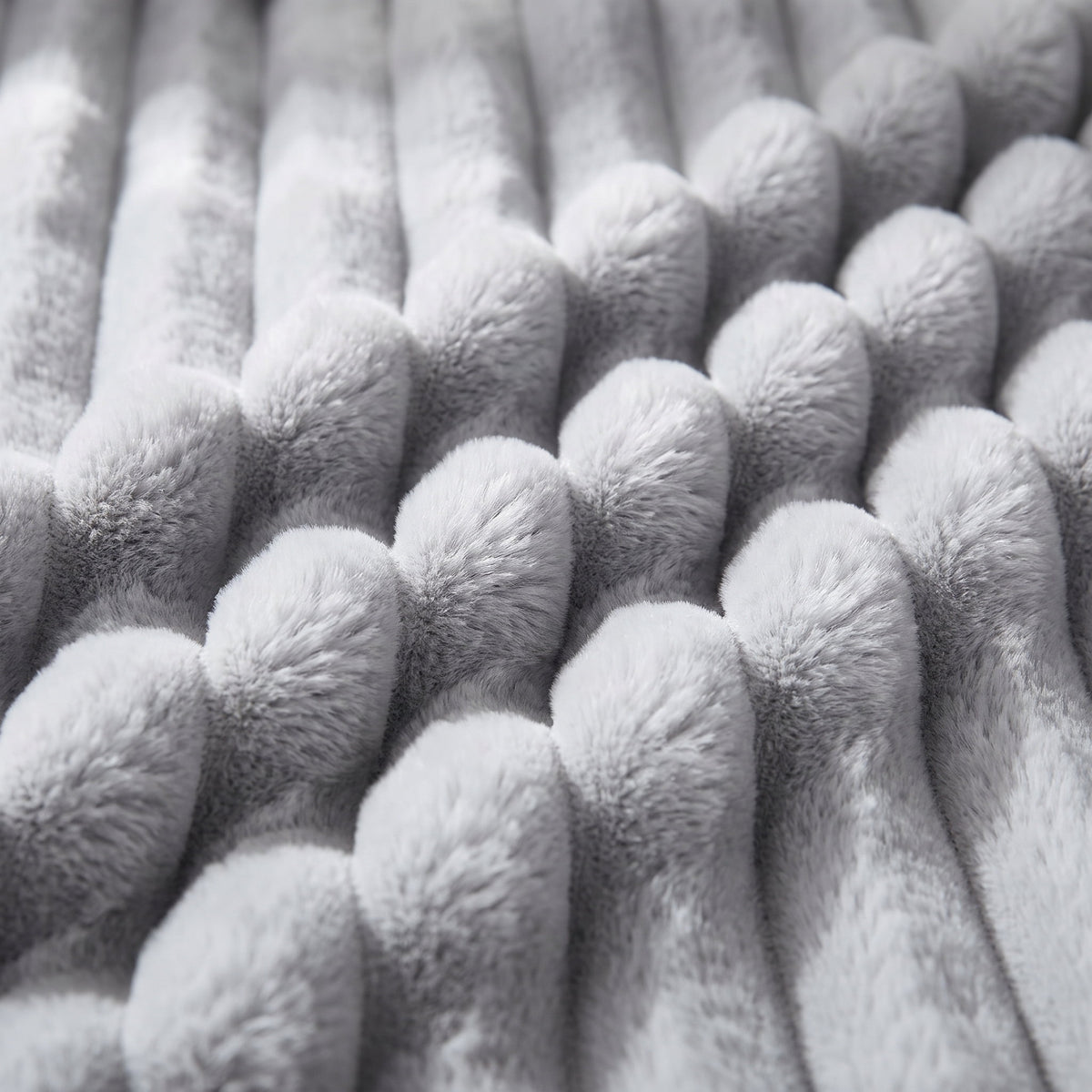 Close-up of the ribbed plush pile of the Cielo throw blanket, Style Room