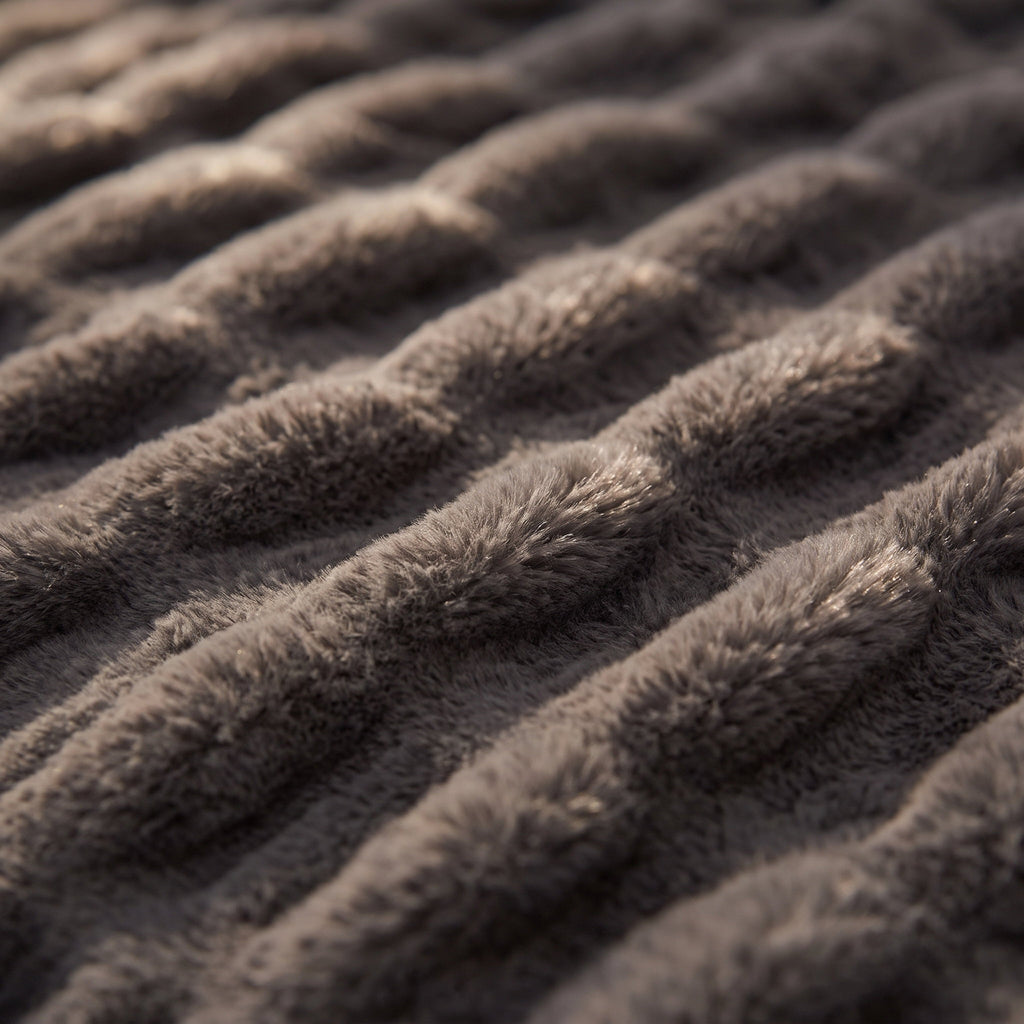 Close-up of the ruched wave texture of the Cora faux fur throw, Style Room