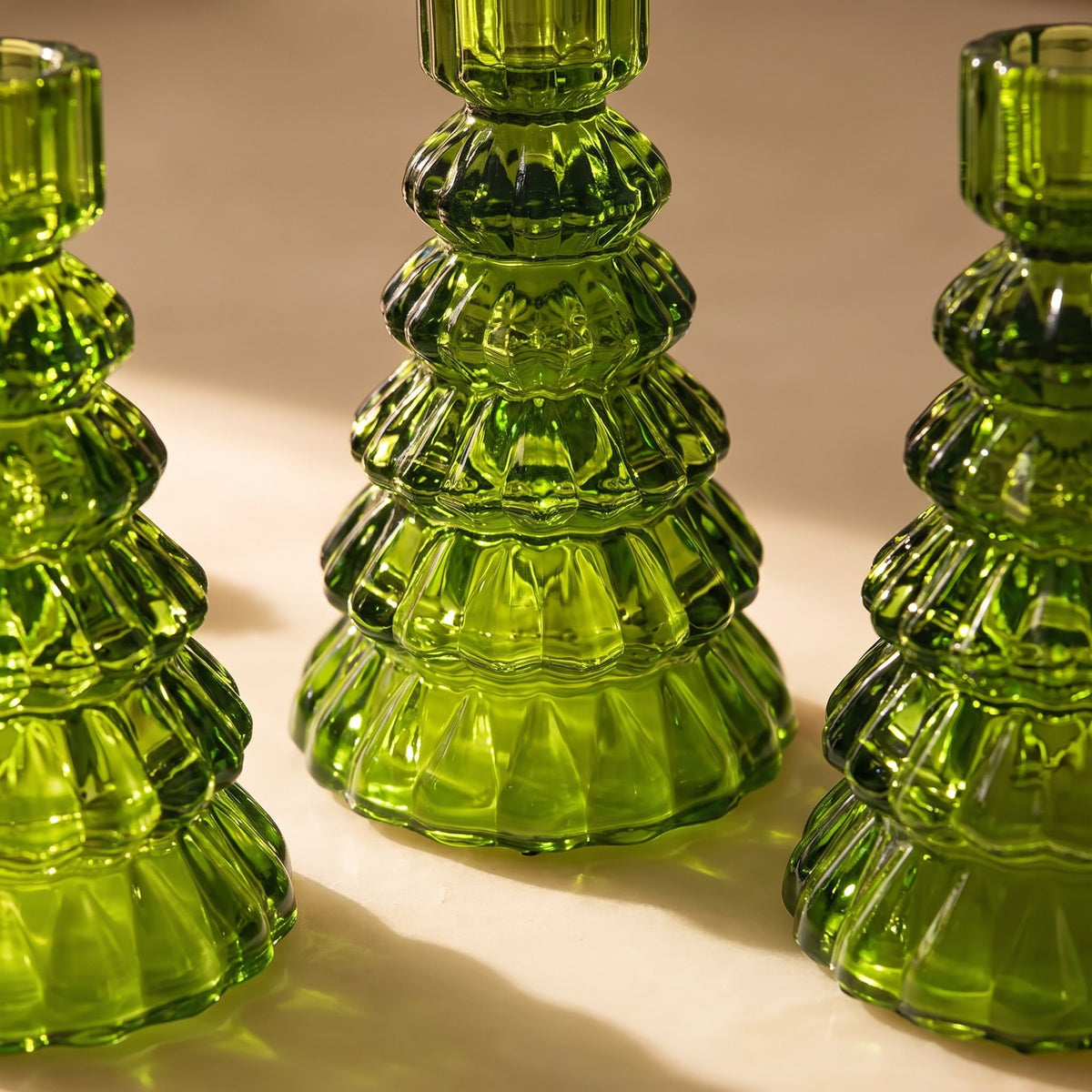 Detail of the moulded green glass ridges on the Cresta Christmas-tree candle holders