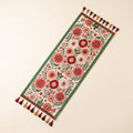 Elysia floral embroidered table runner laid flat with multicoloured tassels, full view