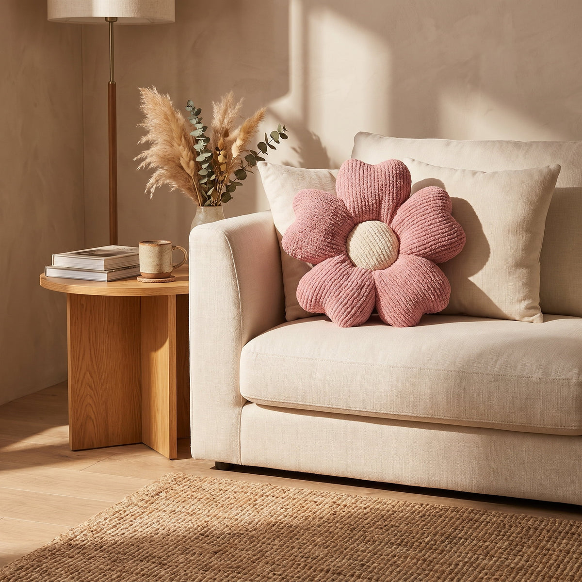 Pink knitted flower cushion on a cream linen sofa in a warm sitting room, Style Room