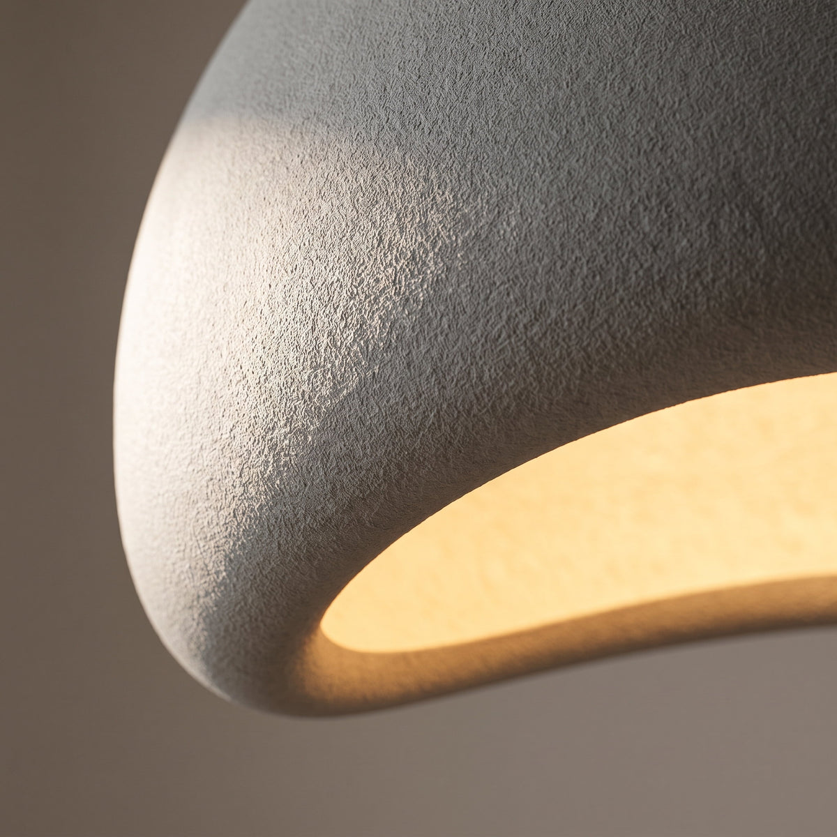 Close detail of the matt textured surface and angled cut edge of the Halo dome shade, Style Room