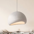 Halo dome pendant light in matt white, lit, hanging in a furnished sitting room, Style Room
