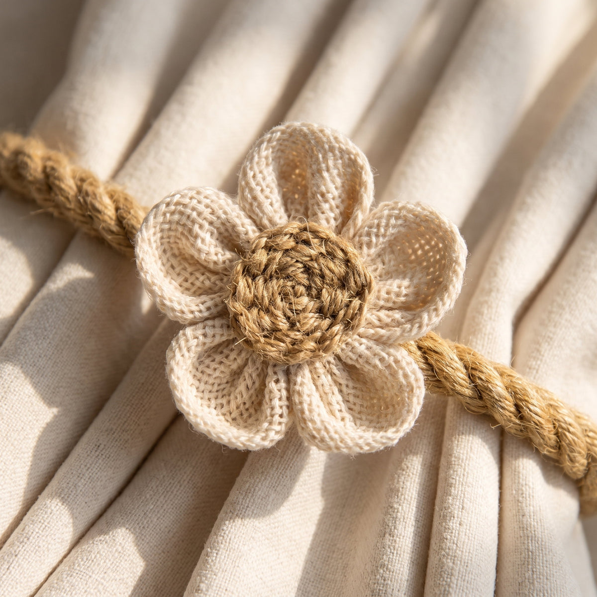 Close-up of the crochet flower and hemp rope of the Haven tieback, Style Room