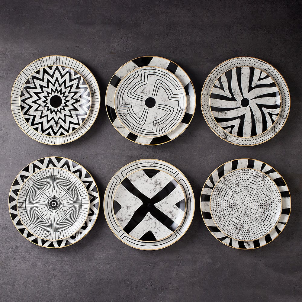 The six Juno plate patterns laid out together on a dark surface