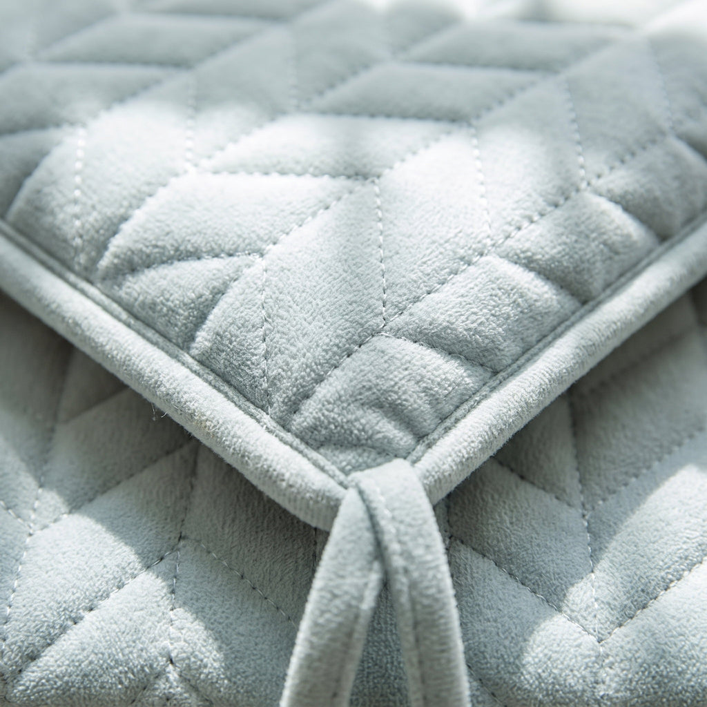 Close-up of the quilted stitching and tie on the Kairo seat cushion, Style Room