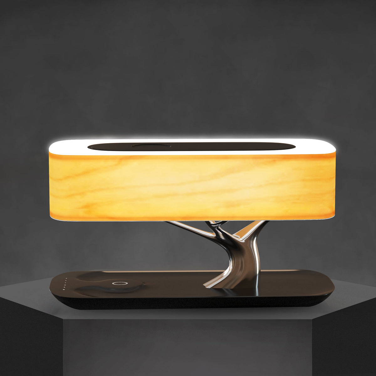 Liora table lamp on a dark plinth, showing the wood grain of the shade and the touch control on the base