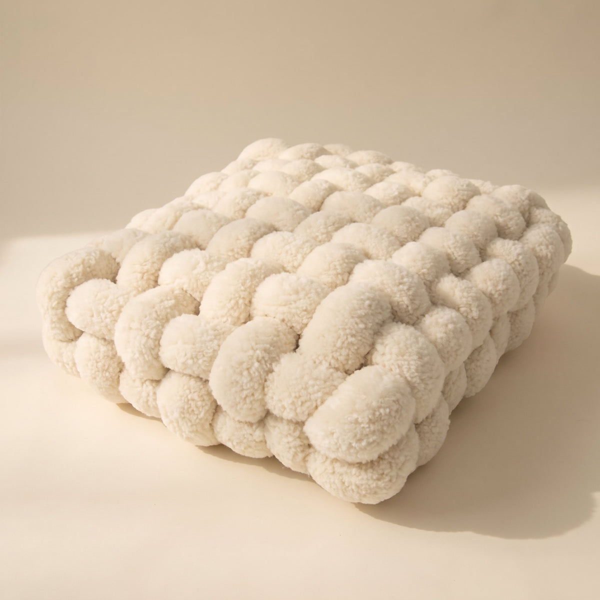 Luma cream woven knot cushion in plush lambswool, Style Room
