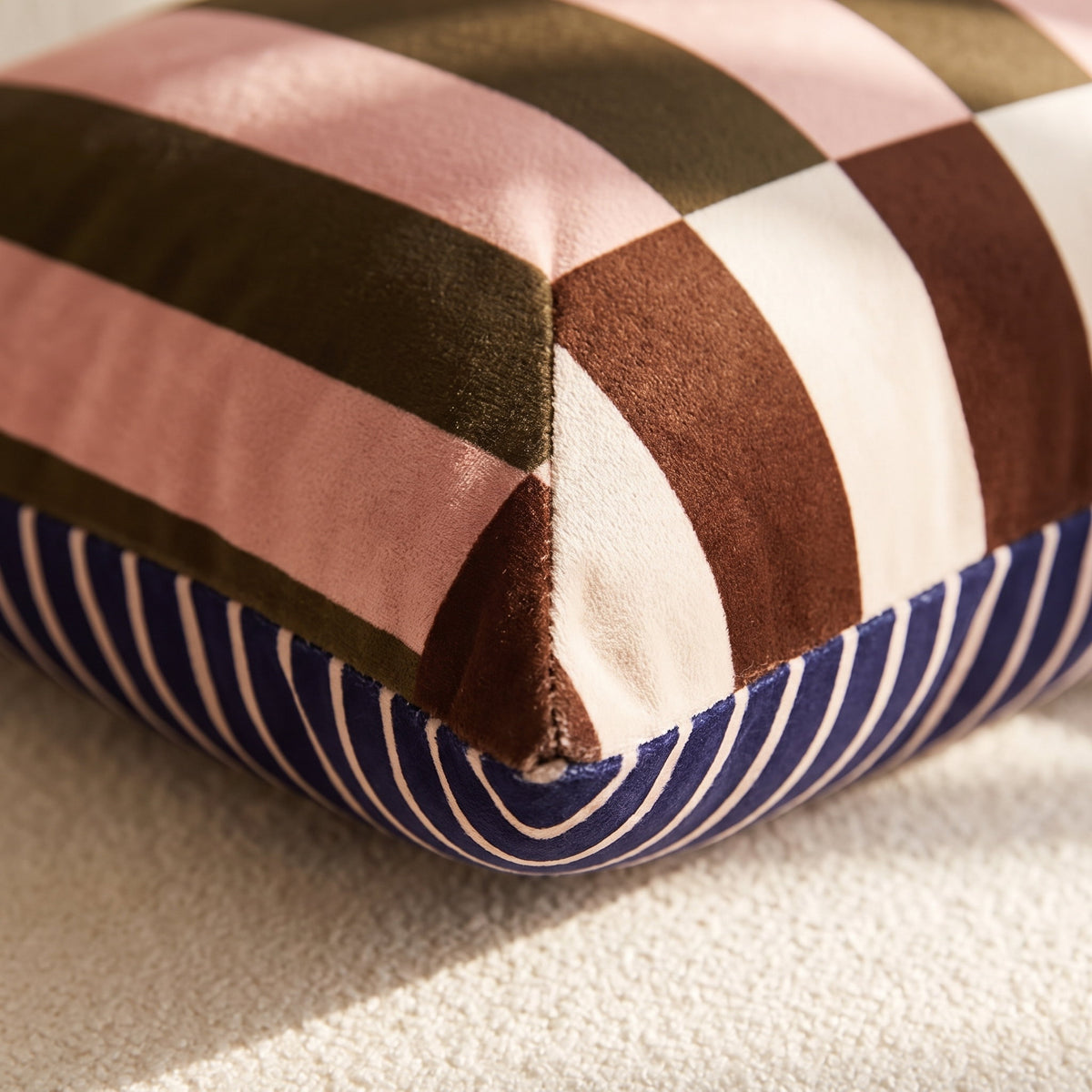 Close-up of the colour-block velvet panels of the Mira cushion, Style Room