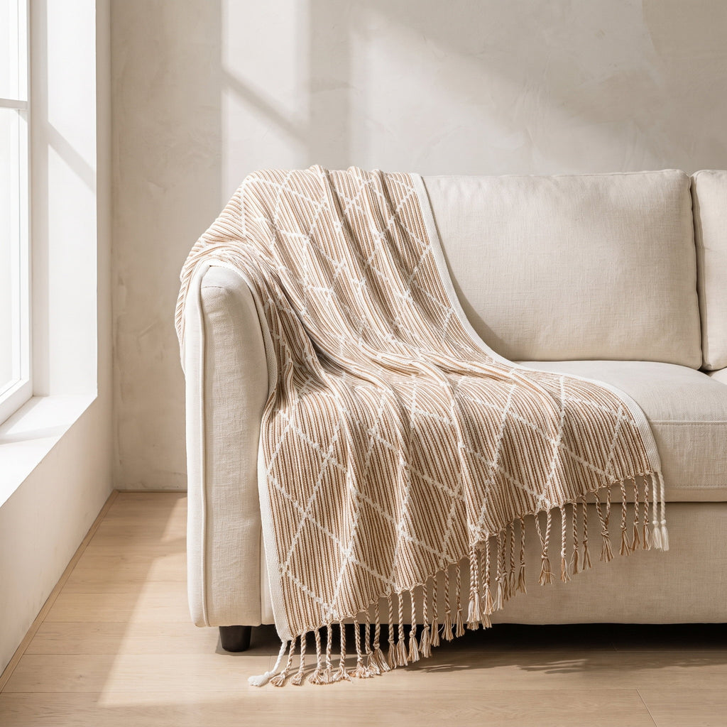 Mira knitted throw draped over a cream linen sofa, Style Room