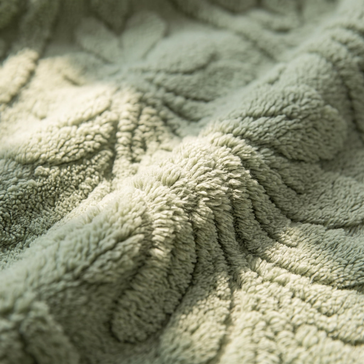 Close-up of the carved botanical relief of the Pavo blanket, Style Room