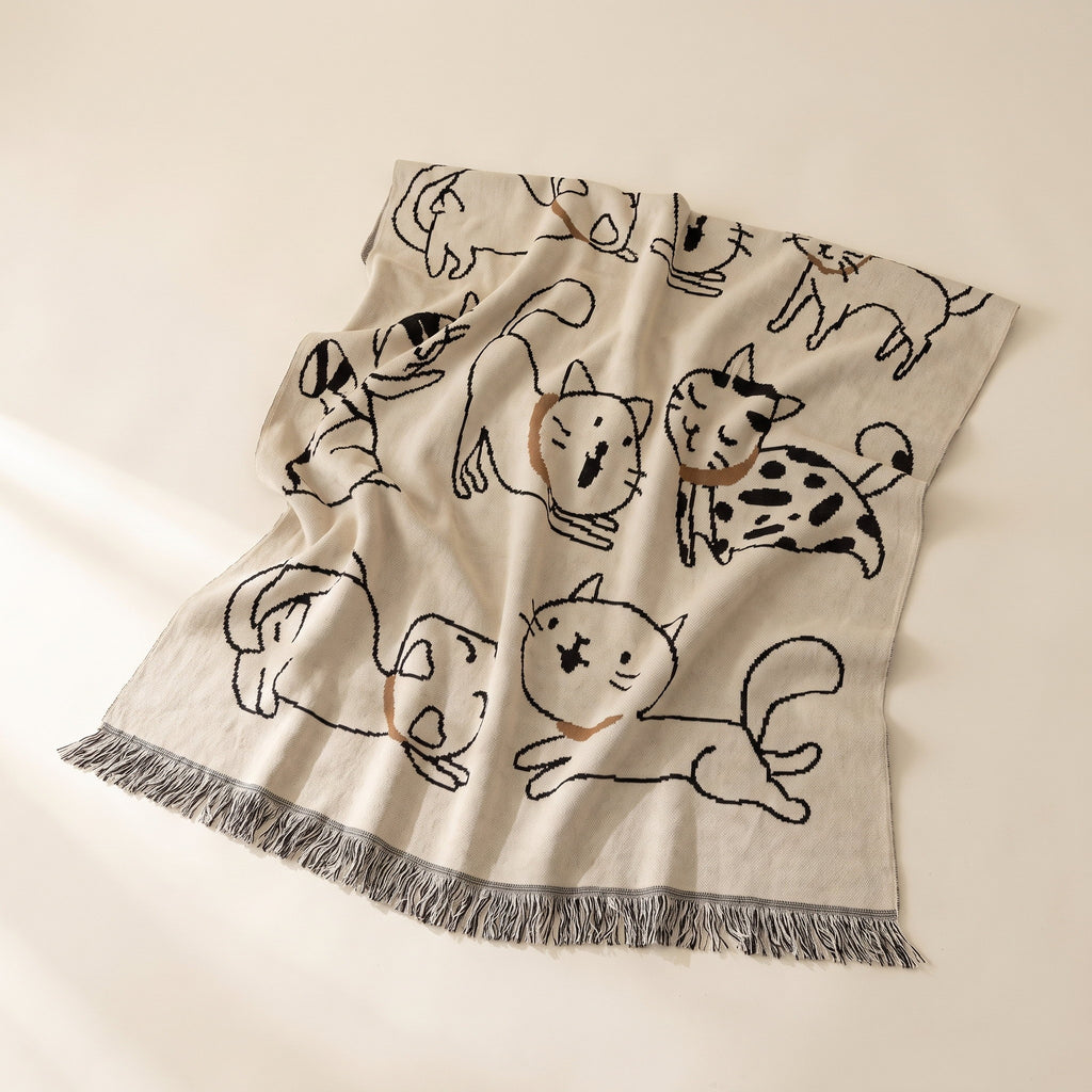 Pavo nap blanket in cream cotton jacquard with black line-drawn cat motifs and fringed edge, Style Room