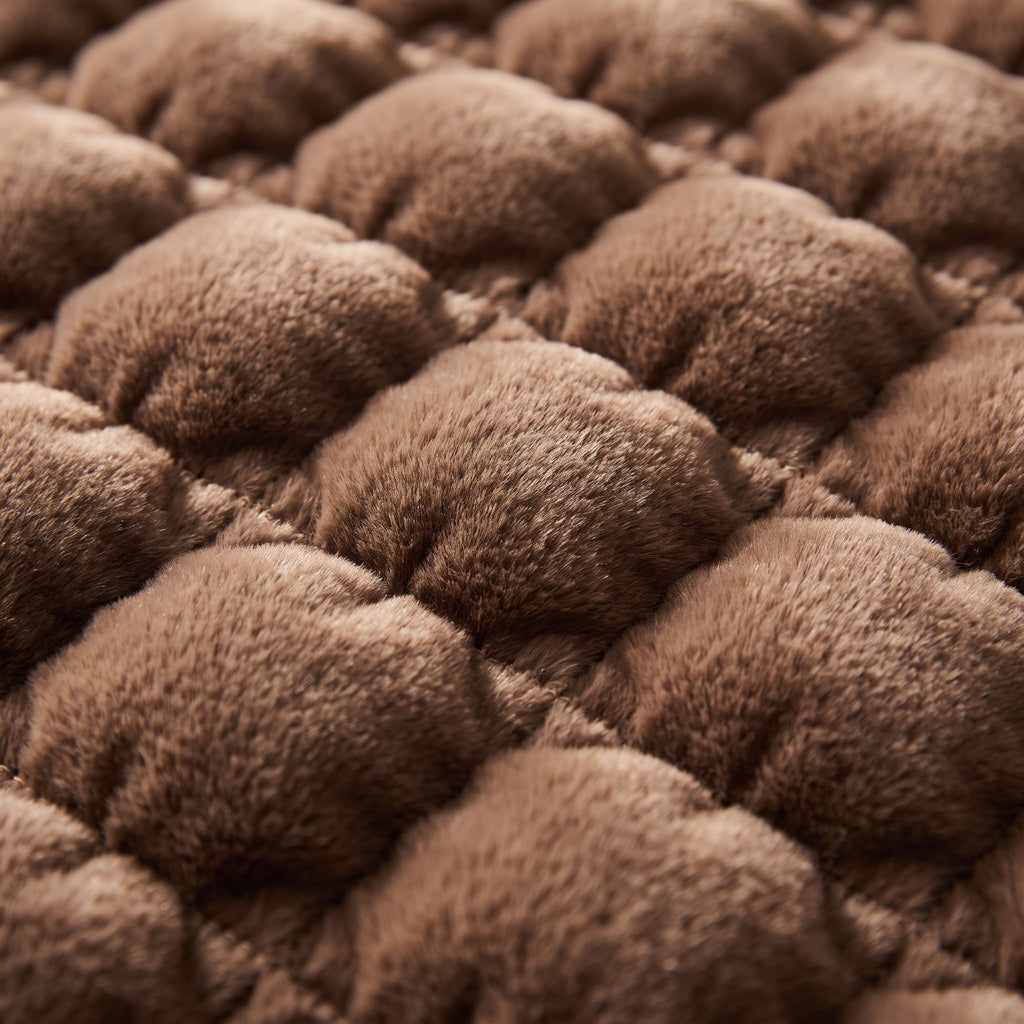 Close-up of the quilted bubble faux-fur pile of the Raven blanket throw, Style Room