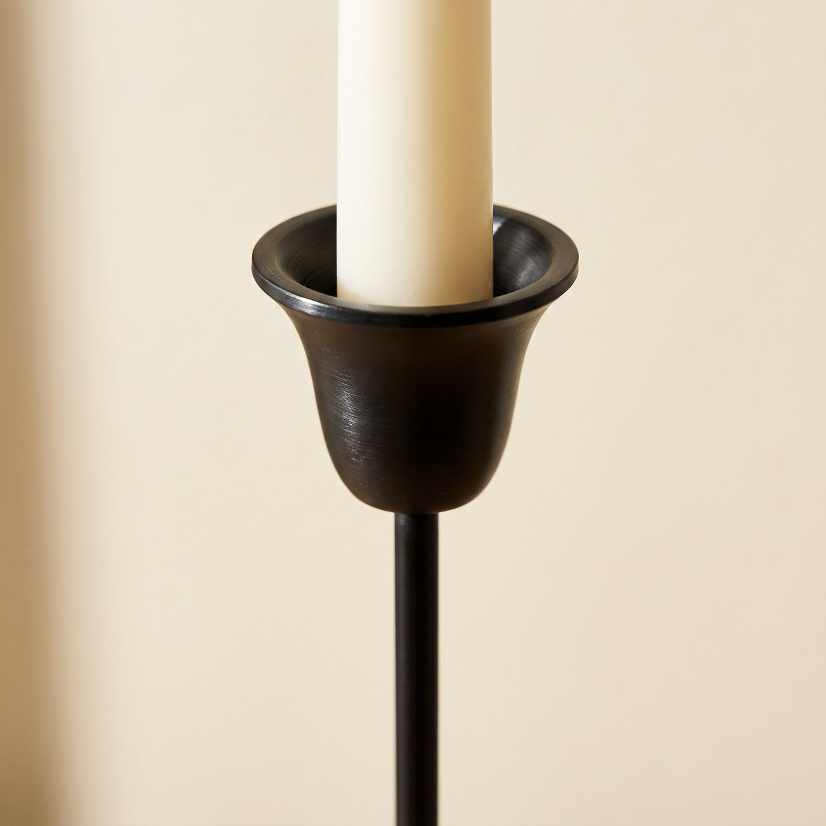 Close-up of the flared candle cup and slim stem of the Sable candlestick, Style Room