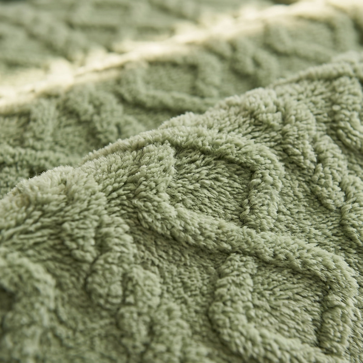 Close-up of the cable relief of the Sable plush blanket, Style Room