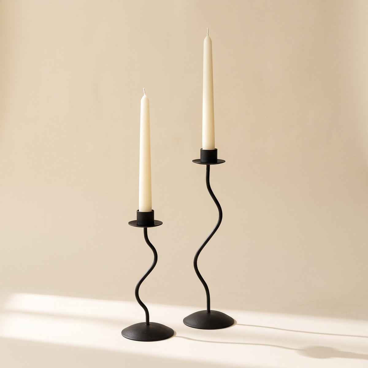 Sable wavy candle holder pair in black lacquered iron with ivory taper candles, Style Room