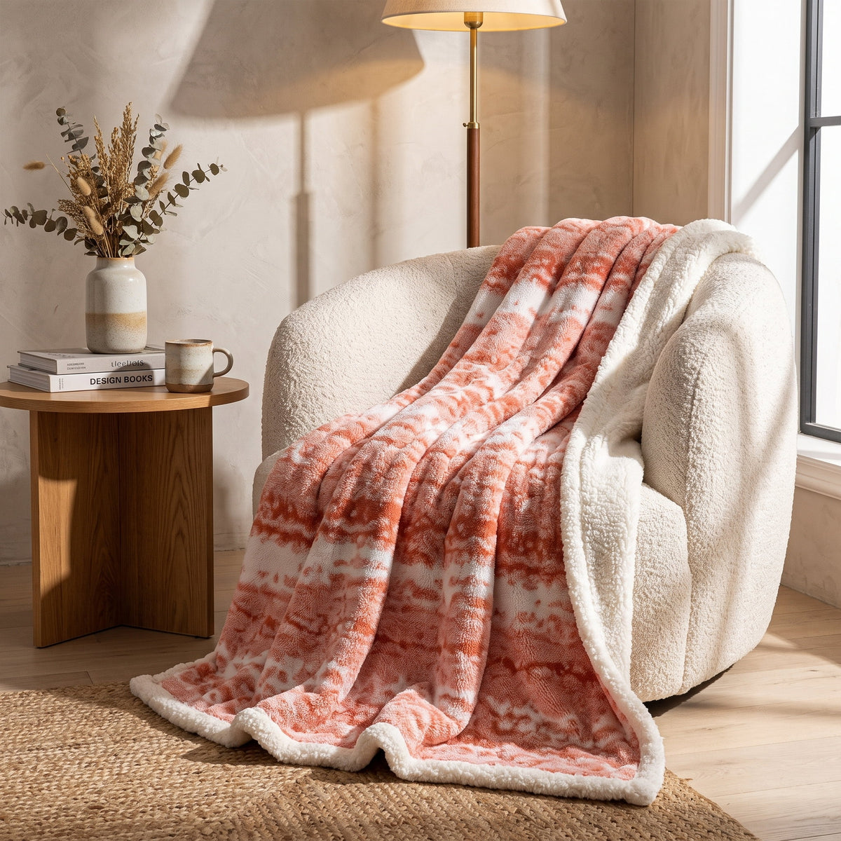 Seraphina coral velvet blanket draped over a cream boucle armchair, Style Room