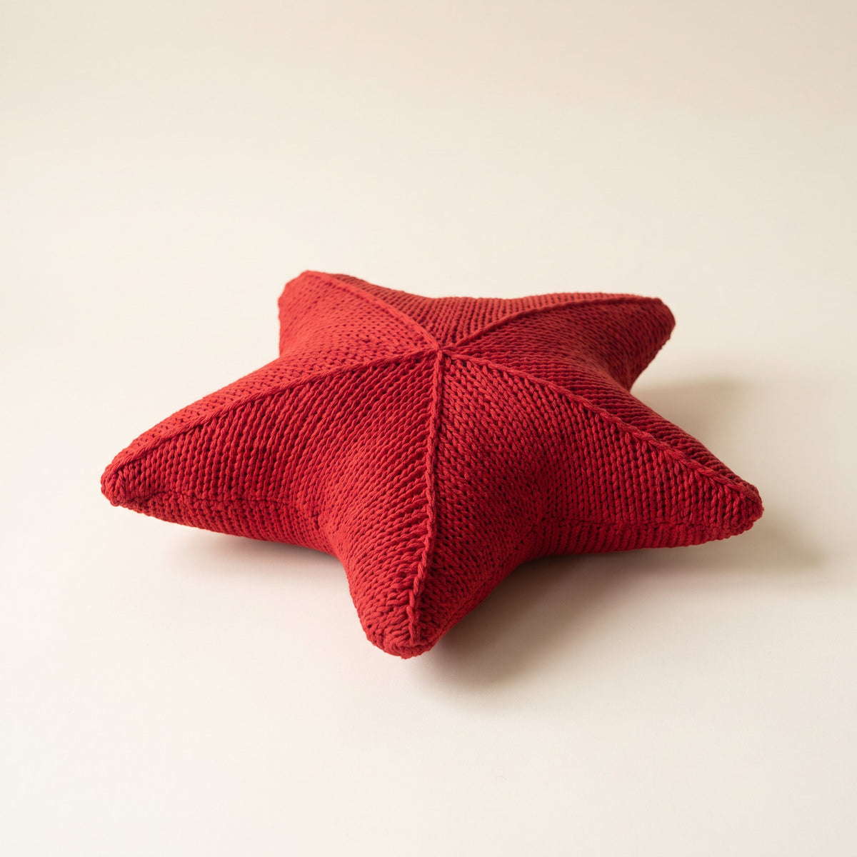 Silky red hand-knitted star cushion, Style Room