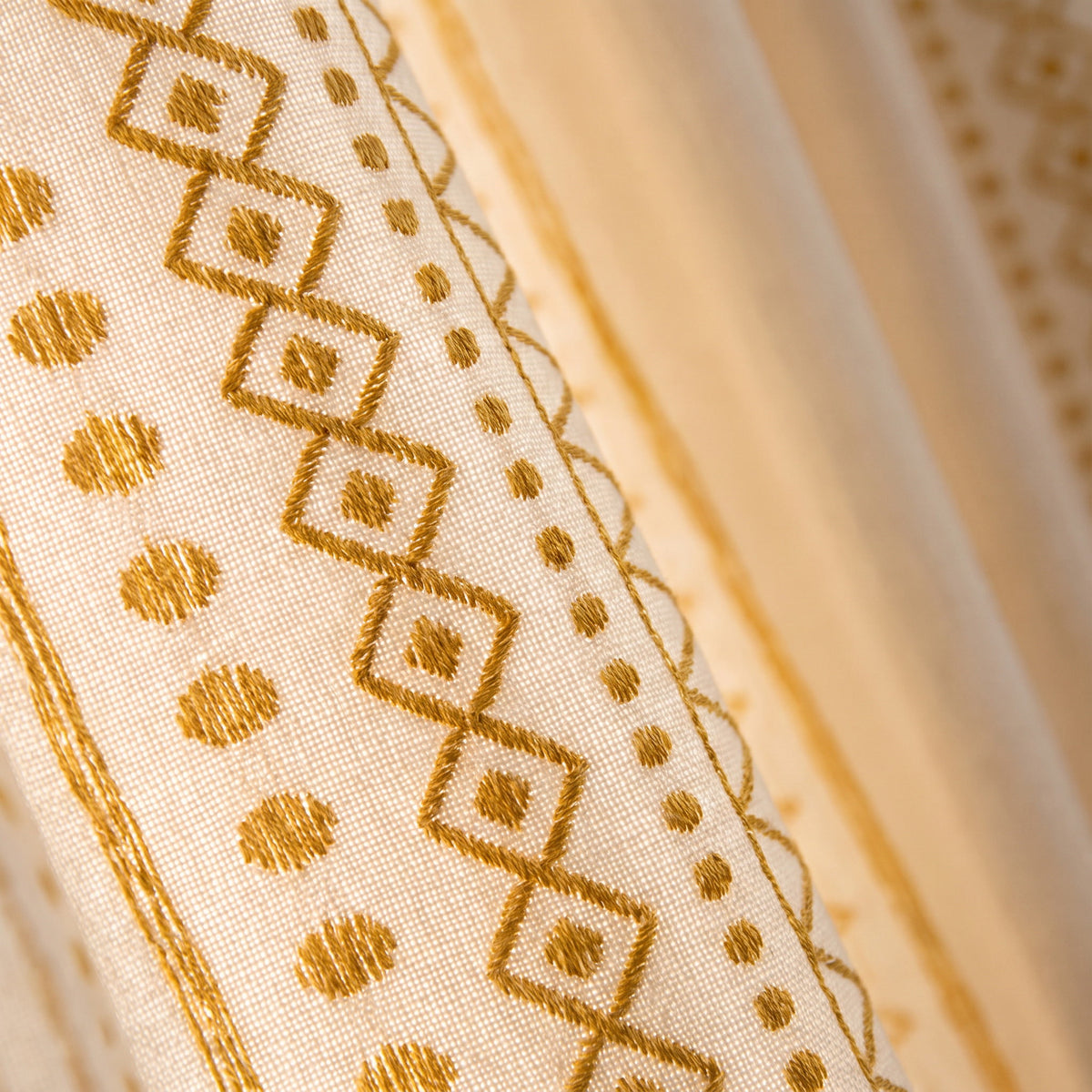Close-up of the gold embroidered stripes of the Solara curtain, Style Room
