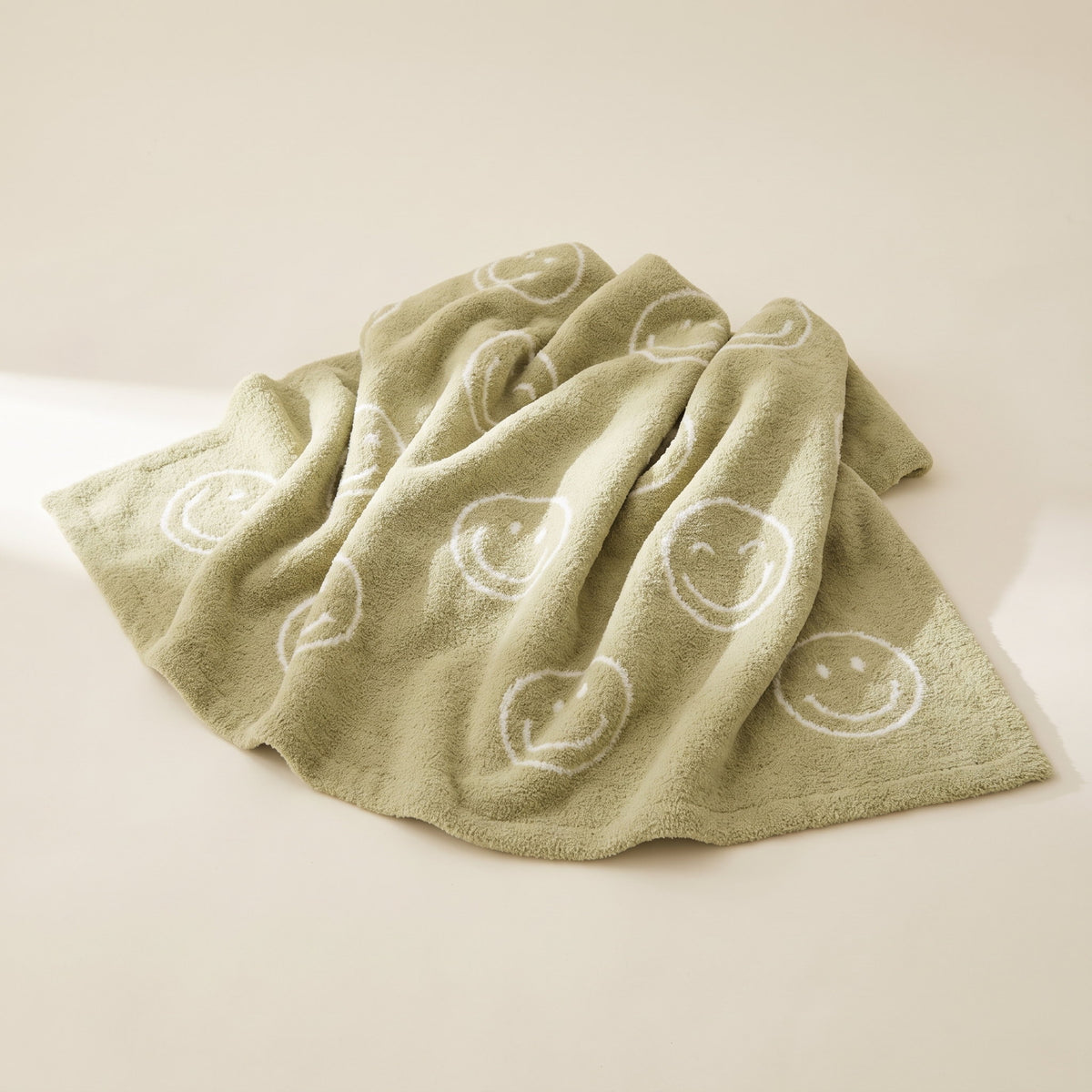 Soleil sage green plush blanket with cream smiley motifs, Style Room