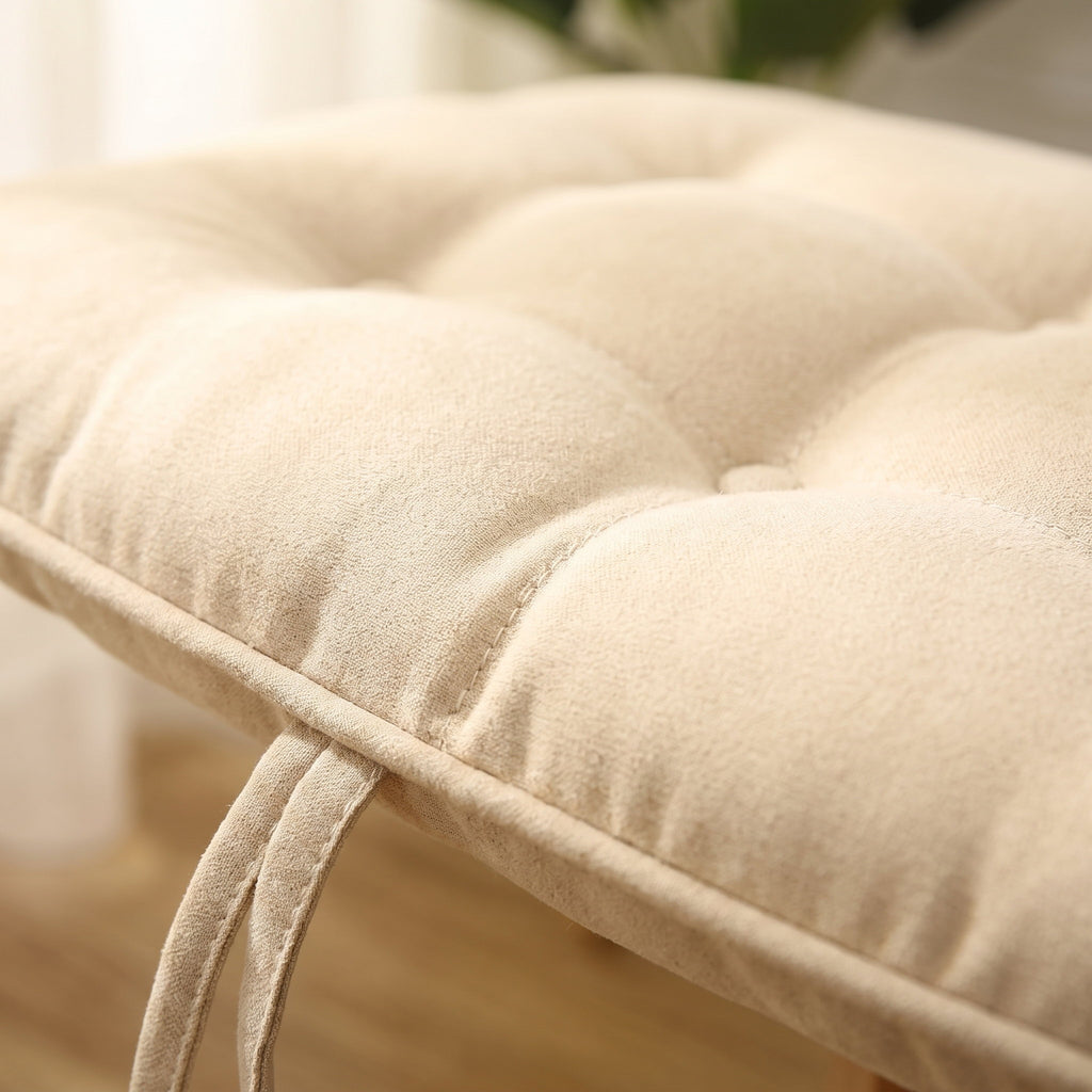 Close-up of the button tufting and soft loft of the Vela chair cushion, Style Room