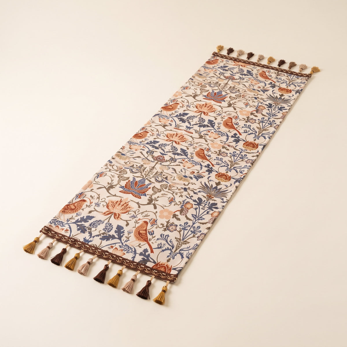 Vera floral jacquard table runner laid flat with tasselled ends, full view