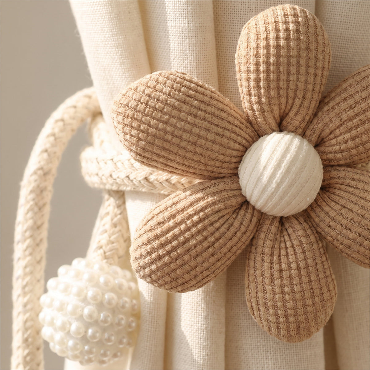 Close-up of the fabric flower and pearl bead of the Wren curtain tie back, Style Room