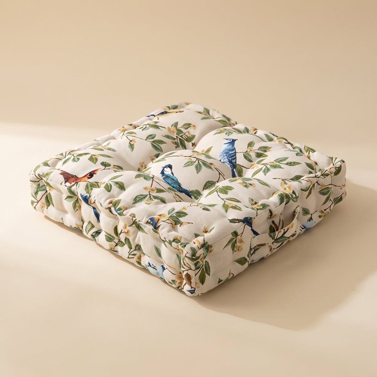 Wren leaf cushion in cream with green leaf and blue bird print and deep tufting, Style Room