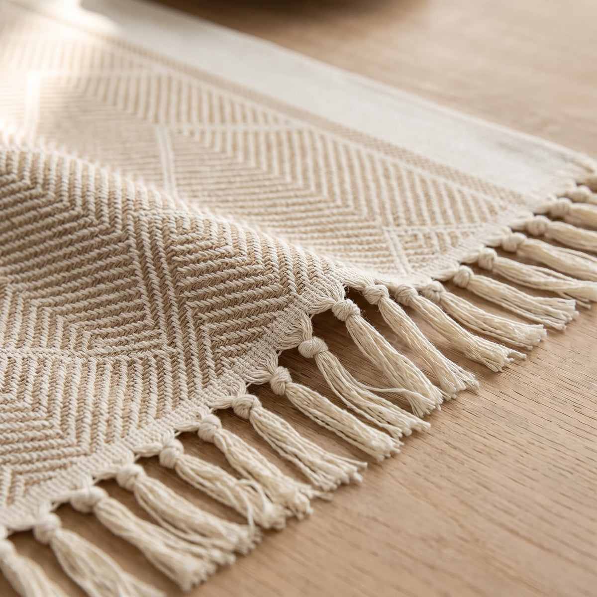 Close-up of the woven zigzag texture and knotted fringe of the Zara runner, Style Room